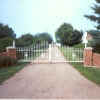 Iron Driveway Gate (double) between brick pillars, arched and with European style designs